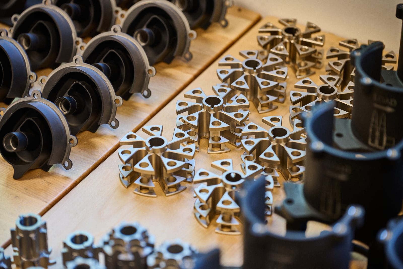 Machined High Ground Defense components arranged during assembly